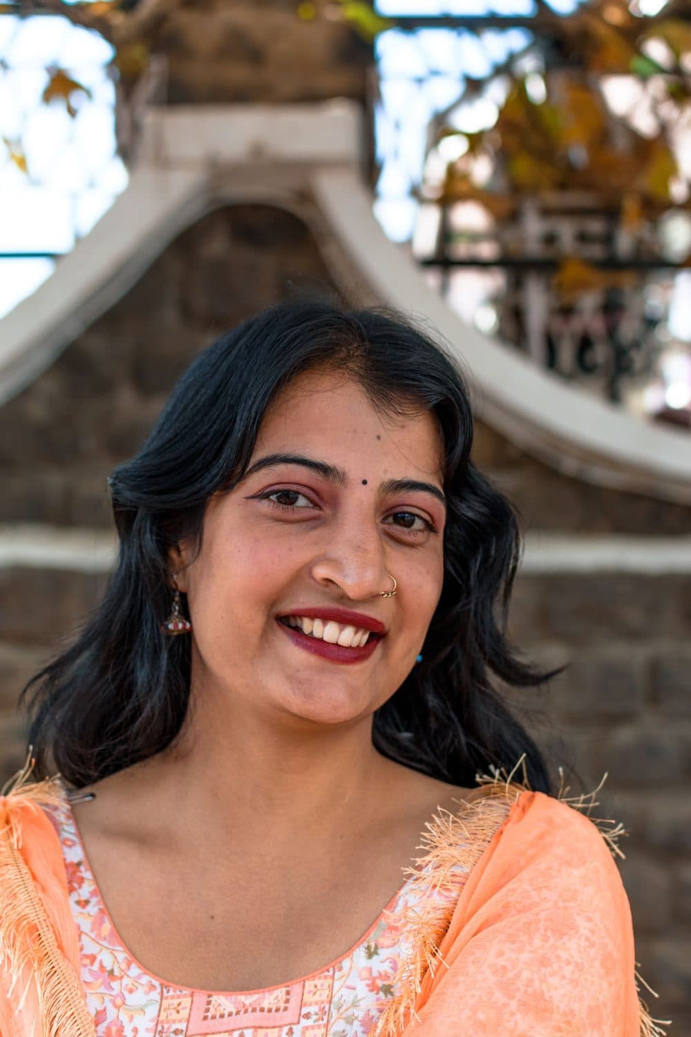 A woman with a warm, confident smile